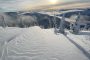 Snowy mountain landscape at sunrise with wave-like patterns in the snow, illustrating natural energy fields and heart resonance with the Earth’s bioelectrical field.